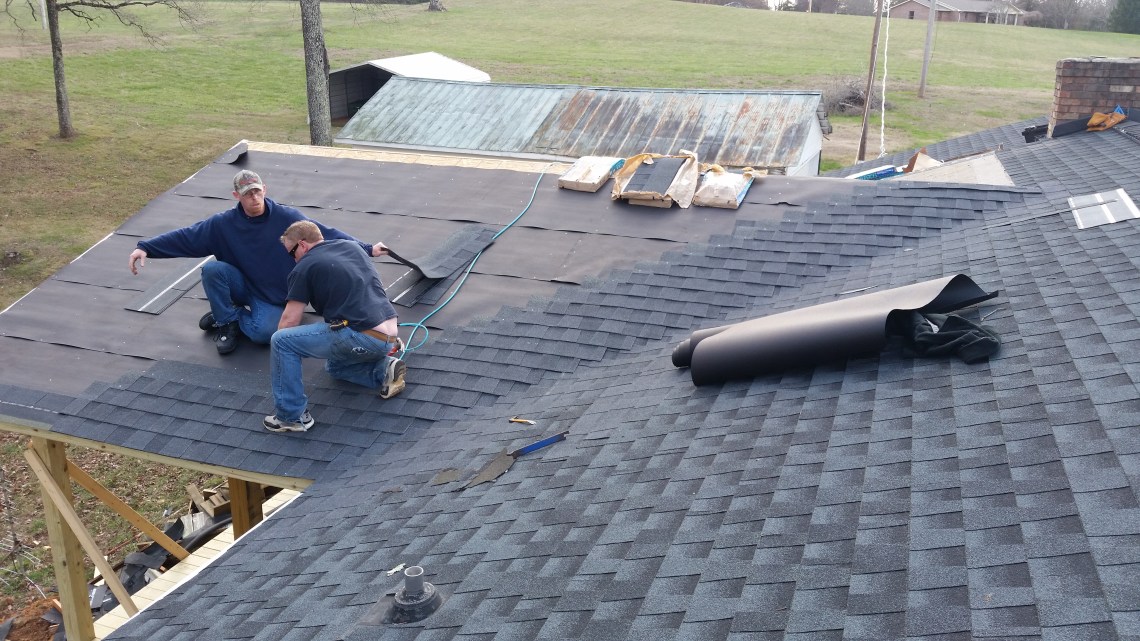 installing shingles on the roof