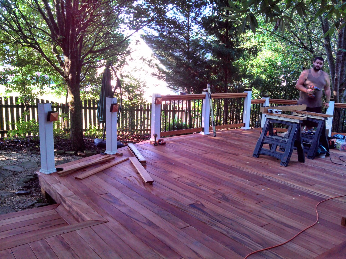 tigerwood deck with handrails being built