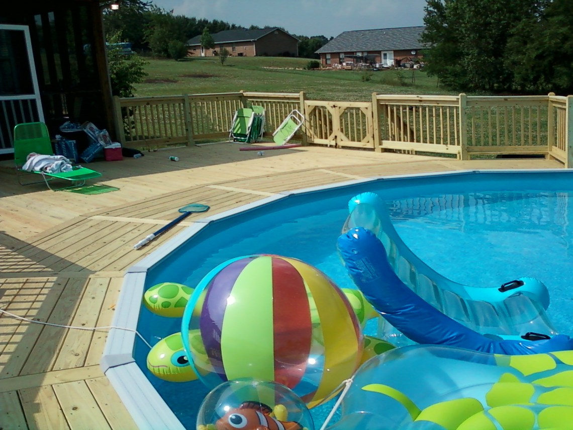 Deck around a swimming pool in Kodak, TN built by The Deck Builder.