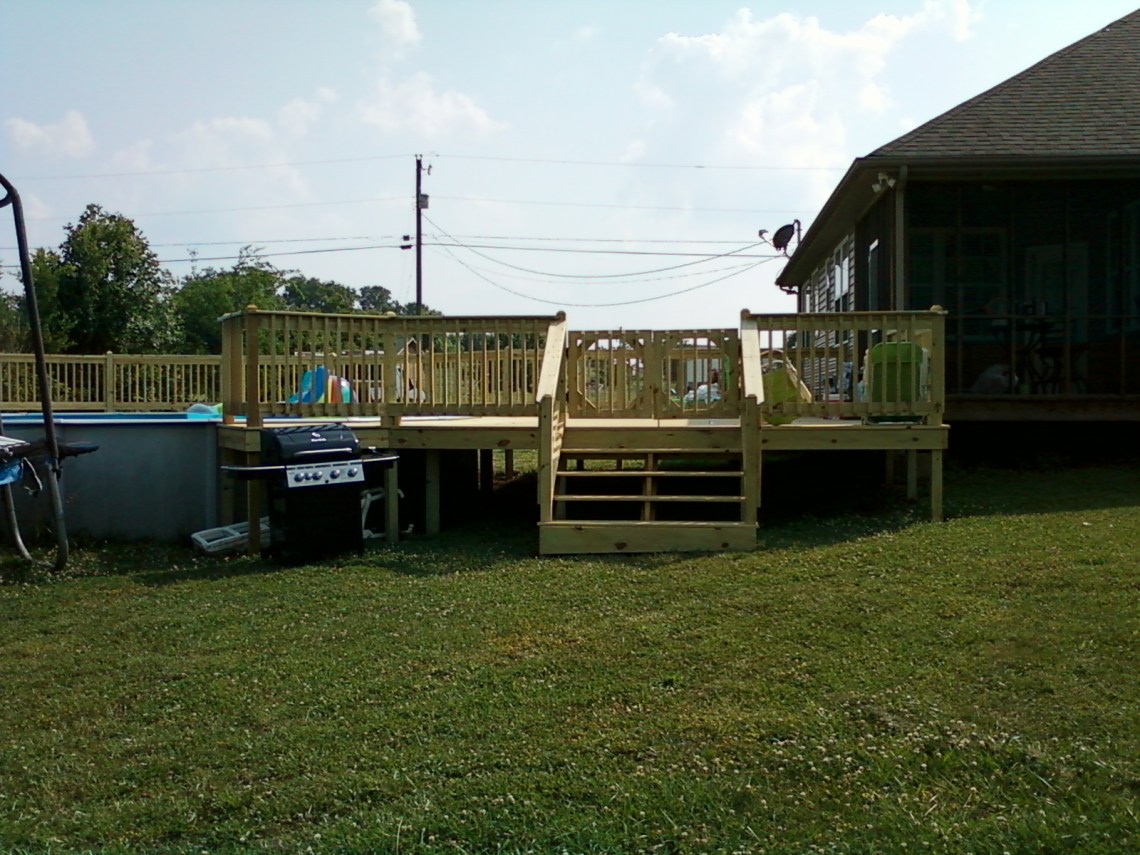 Deck around a swimming pool in Kodak, TN built by The Deck Builder.