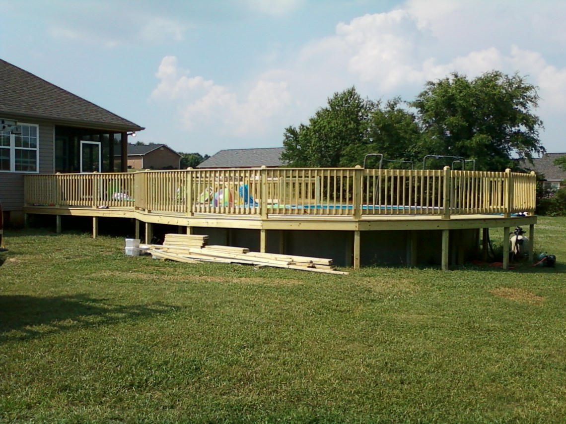Deck around a swimming pool in Kodak, TN built by The Deck Builder.