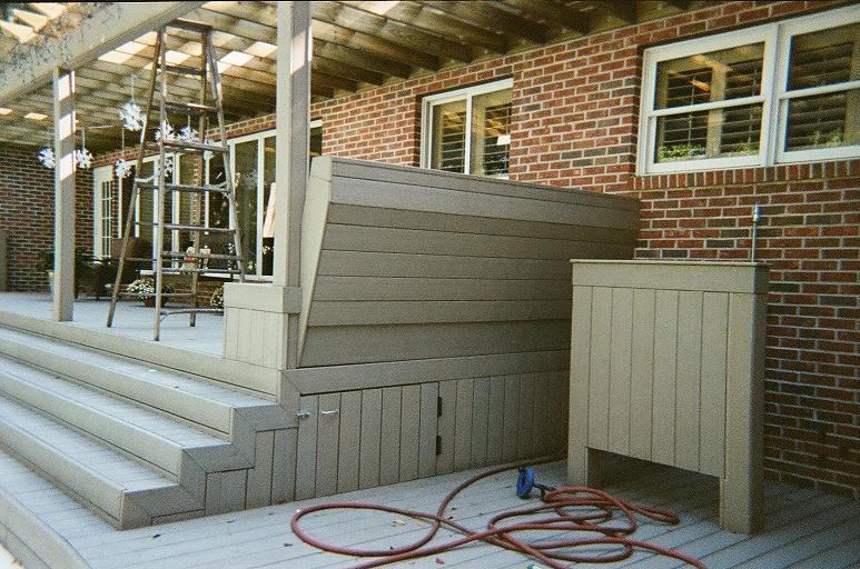 Storage compartment under the deck for swimming pool tools
